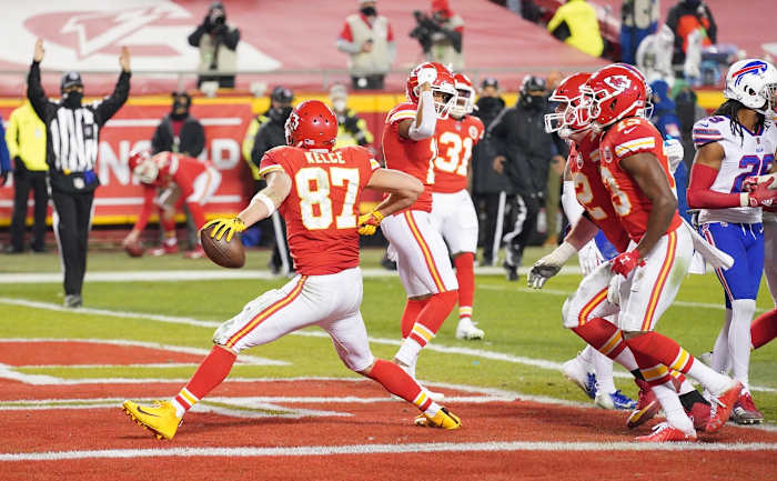 Chiefs tight end Travis Kelce (87) celebrates after scoring a touchdown against the Buffalo Bills during the third quarter in the AFC Championship Game at Arrowhead Stadium.